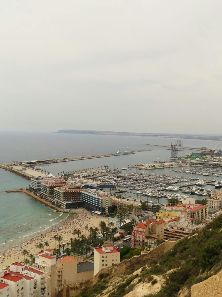 pexels photo 32531560 32531560 Scenic aerial view of Alicante marina and beach, bustling with visitors on a clear day.